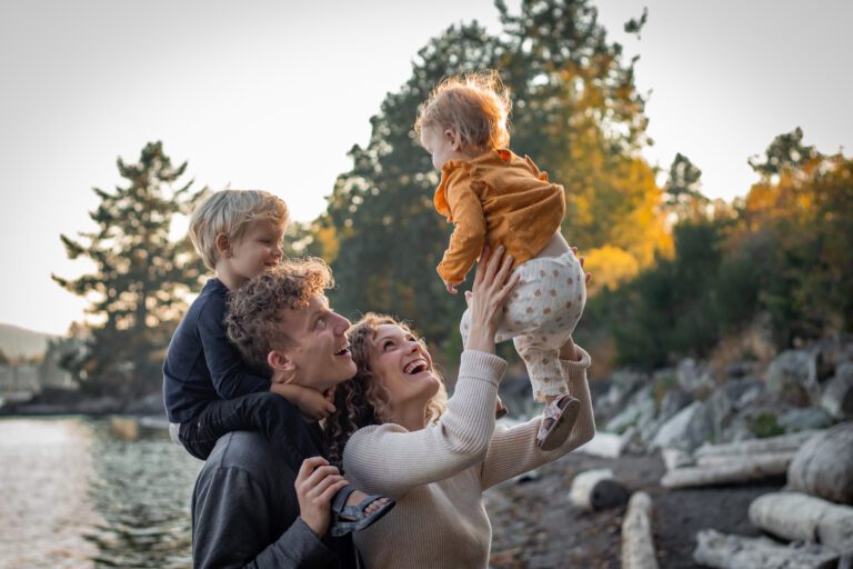 child thrown in the air play beach family photoshoot victoria bc photographer