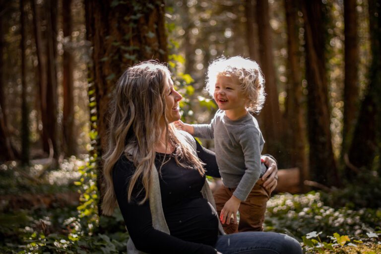 child and pregnant mom exploring in the forest maternity session horth hill regional park victoria bc