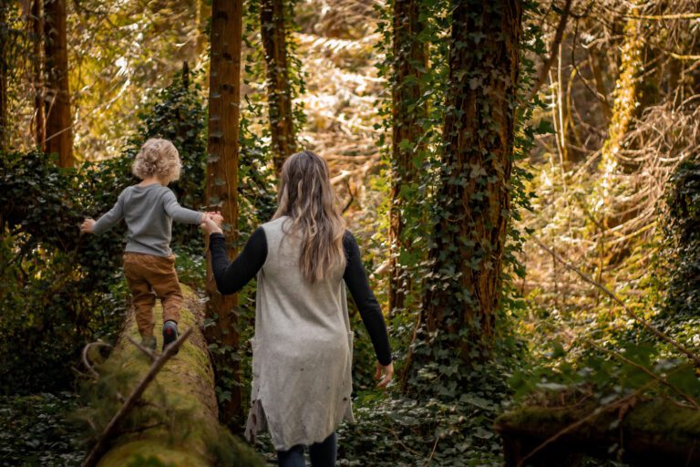 child and pregnant mom exploring in the forest maternity session horth hill regional park victoria bc