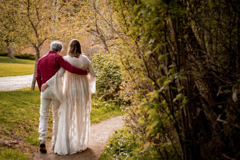 romantic couple with pregnant woman walking along a forest trail maternity photoshoot at horth hill regional park north saanich bc with alyssa orrego photography